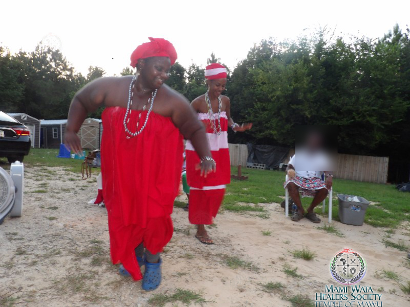 Initiates dancing in sacred ceremony.