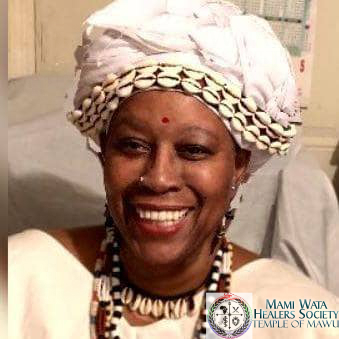 Mama Sagbe, smiling.