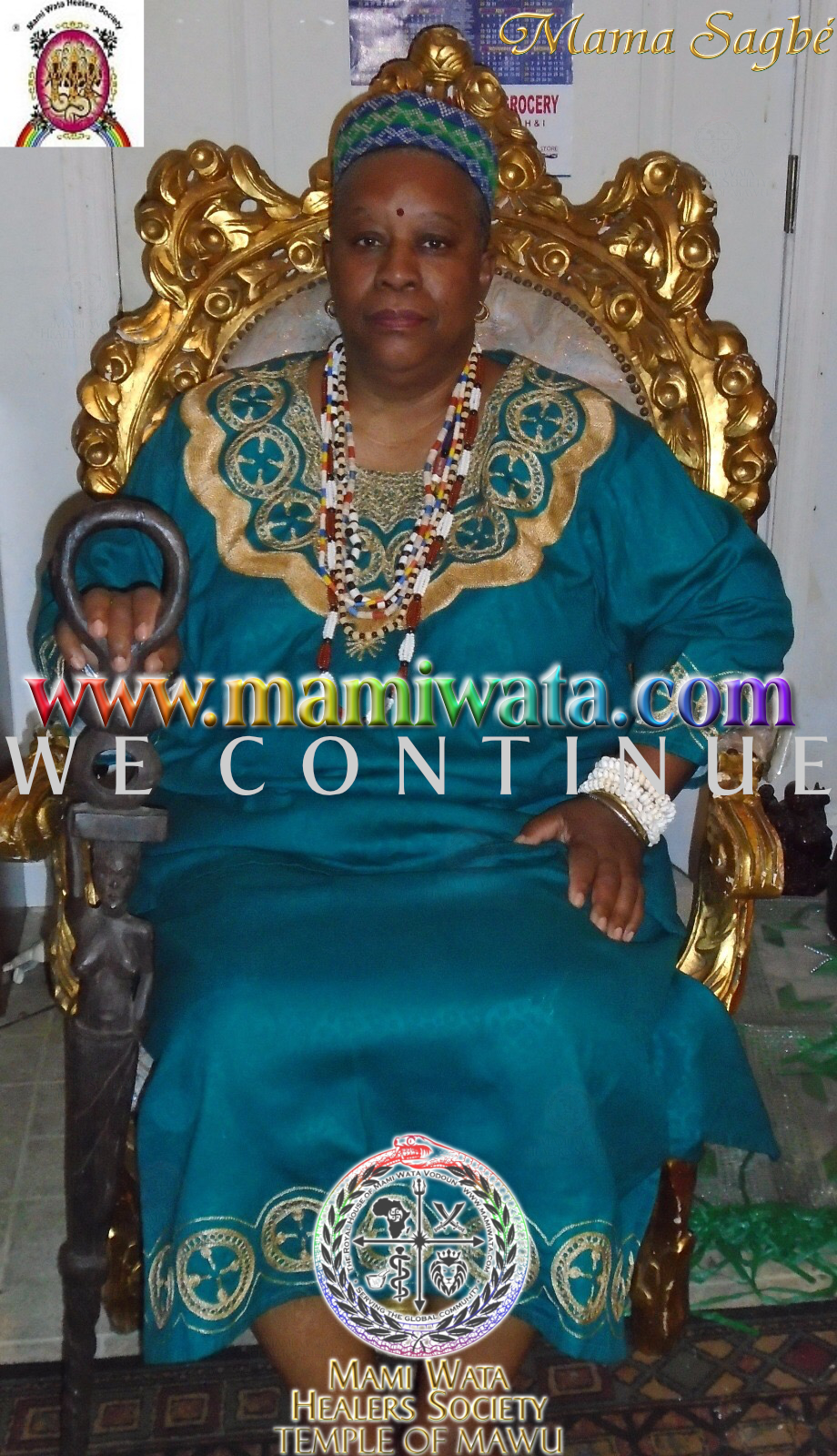 Mama Zogbe, wearing teal and custom spiritual regalia.