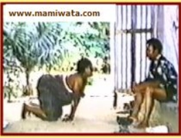 Devotee in respectful pose to priest.
